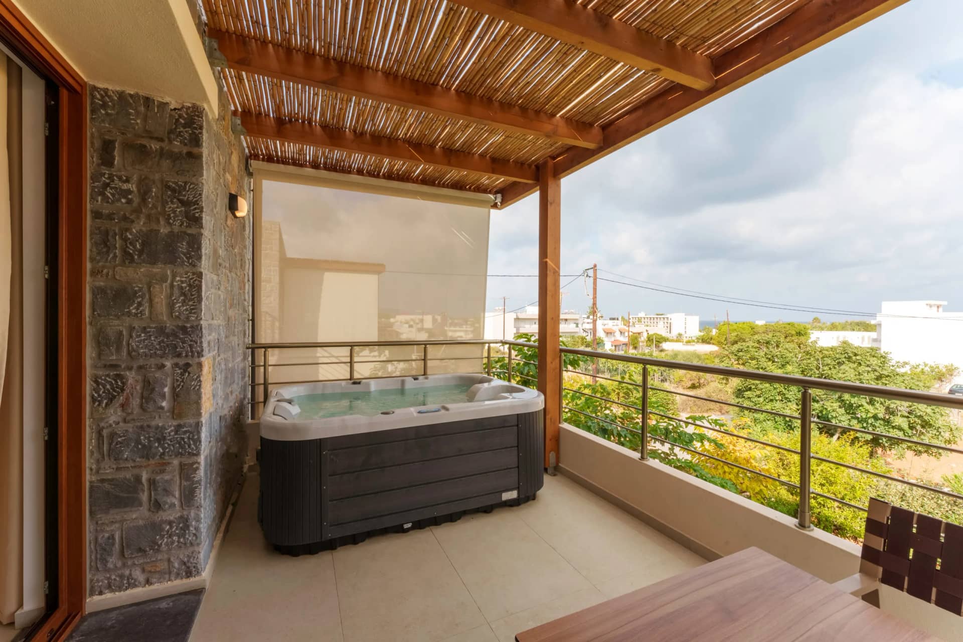 Two bedroom suite interior with garden view and access to the private outdoor hot tub